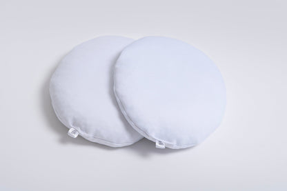 Pair of Oumènta breast implant sizers designed to help women try on and compare breast implant sizes at home before breast augmentation surgery.